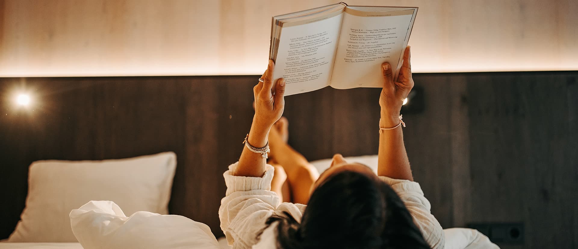 Reading a book in the bed