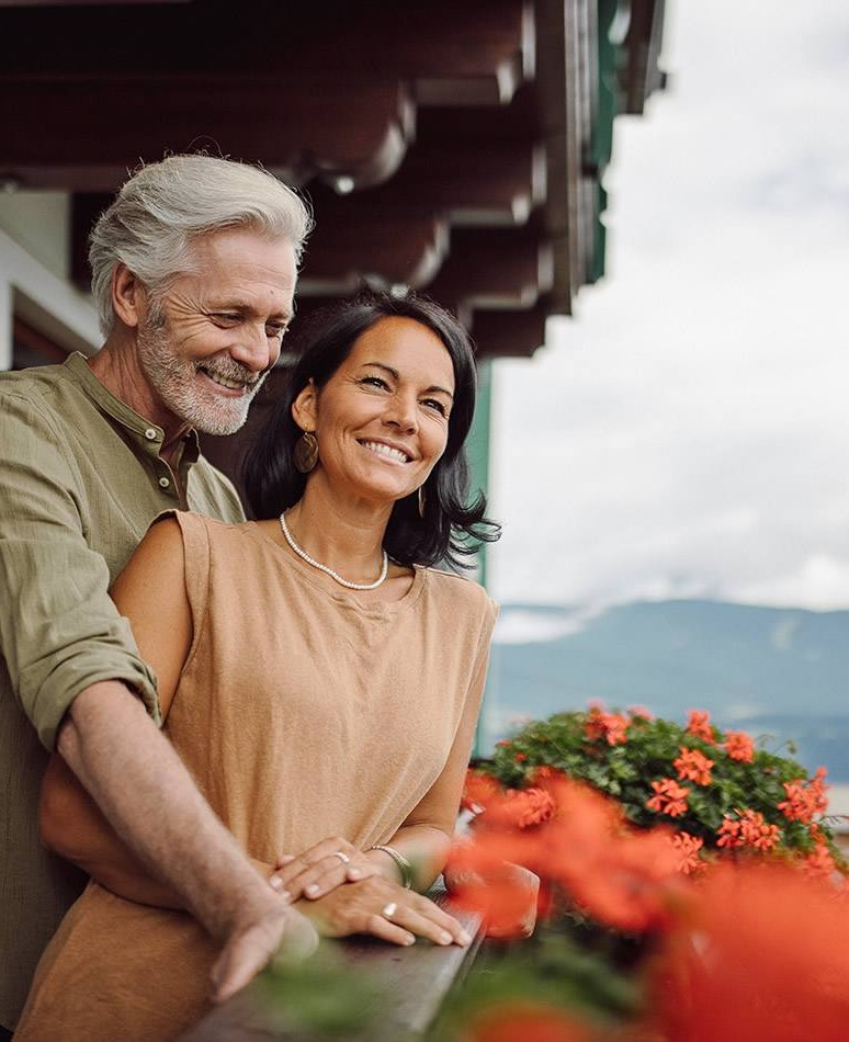 Guests on the balcony are enjoying the scenic view